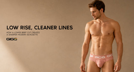 Adult male model wearing a modern low rise brief with a clean waistband, lower cut, and sharp editorial silhouette.
